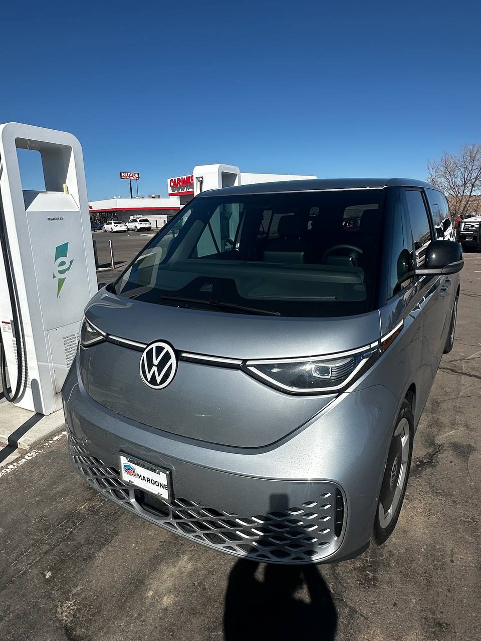 VW ID Buzz front view at EV charging station - zero emission shuttle
